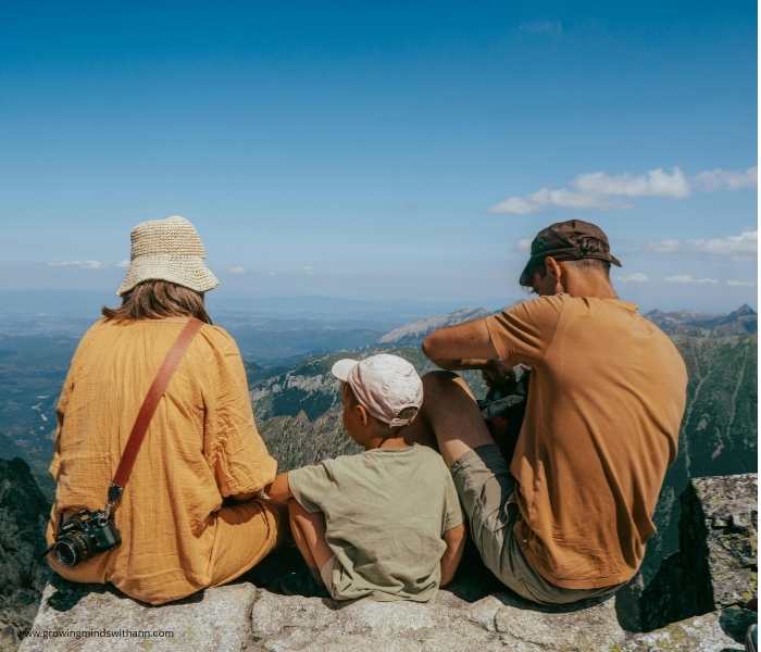 Mom-dad-and-son-on-a-hill-in-summer-bucket-list-ideas-for-families.