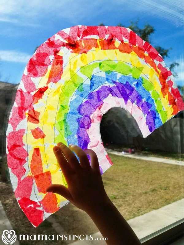 Sun-catcher-rainbow-displayed-on-a-window-in-sun-crafts-for-kids.