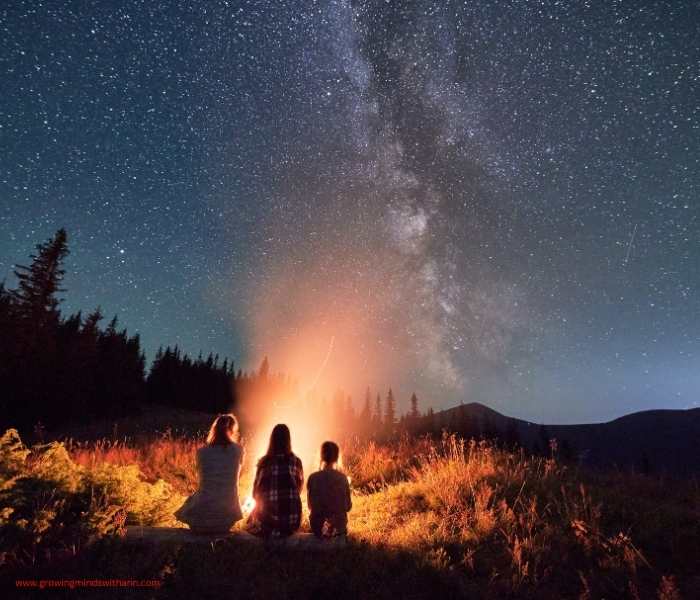 Mom-stargazing-with-her-two-kids-in-summer-bucket-list-ideas-for-families.