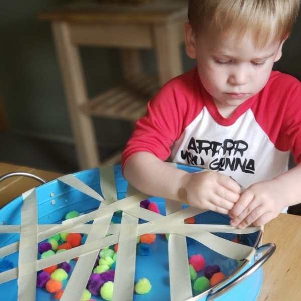 Toddler-playing-ball-reach-and-grab
