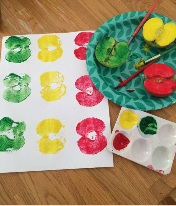 Green-yellow-and-red-apple-stamp-on-a-white-paper.