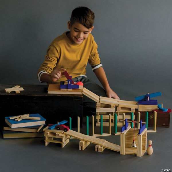 Boy-playing-with-building-plank-toy-set-in-STEM-toys-kids-actually-love.