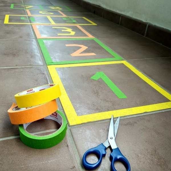 Hopscotch-made-from-different-colors-of-masking-tapes-in-masking-tape-activities-for-toddlers-that-are-easy-and-fun.