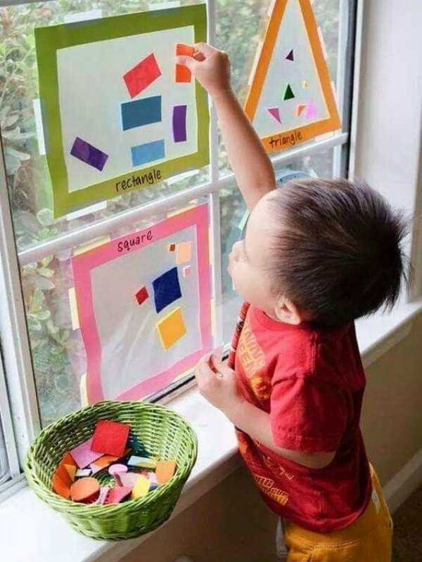 Toddler-playing-the-tape-shape-hunt-in-masking-tape-tape-activities-for-toddlers-that-are-easy-and-fun.