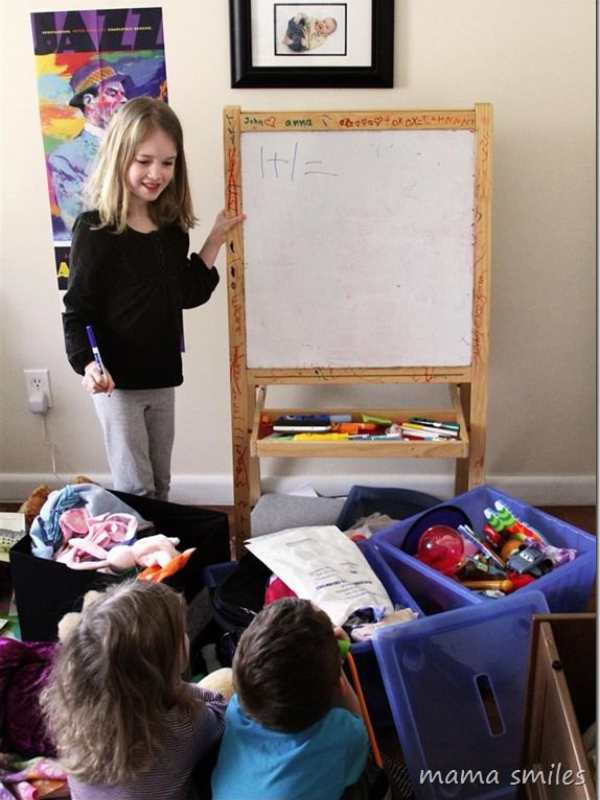 Child-beside-a-board-teaching-in-how-to-prepare-your-child-for-their-first-day-of-school.