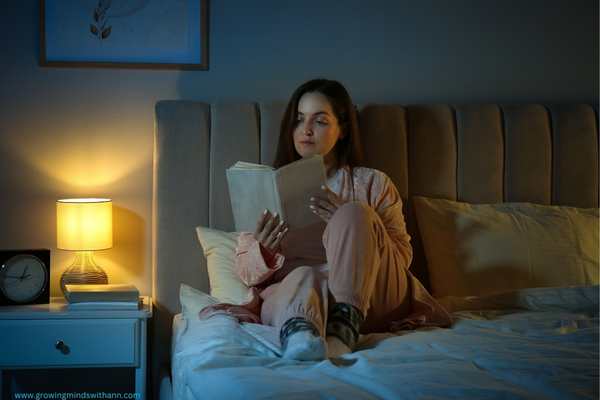 Mom-reading-while-sitting-on-a-bed.