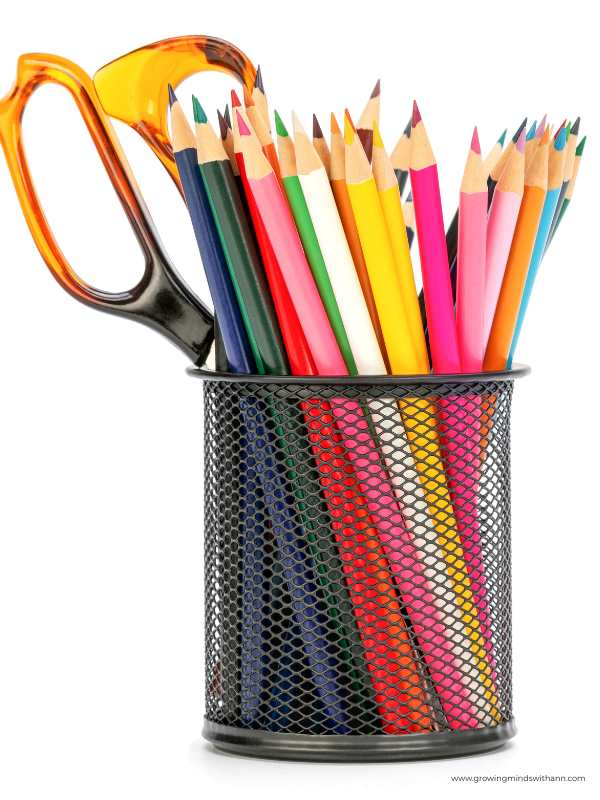 Scissors-pen-and-pencil-arranged-in-a-container.