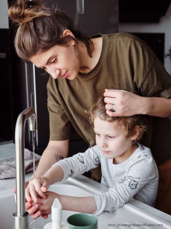 Mom-pacifyinfg-a-child-while-trying-to-wash-the-child's-face.