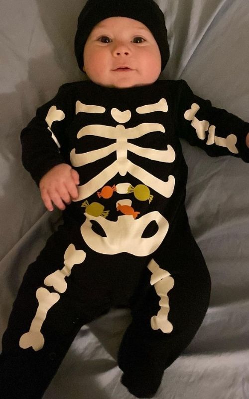 Baby-dressed-in-skeleton-costume-in-baby's-first-halloween-costume-ideas.