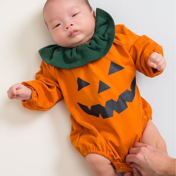 Baby-dressed-in-pumpkin--costume-in-baby's-first-halloween-costume-ideas.
