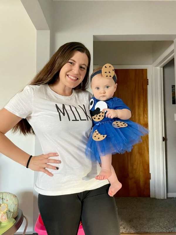 Mom-dressed-n-white-polo-written-milk-while-baby-dressed-as-cookie-monster.