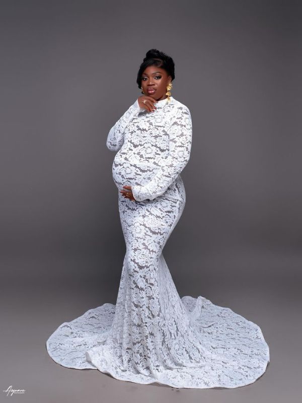 Woman-lace-maternity-dress-in-gender-reveal-outfit-ideas-for-mom-to-be.
