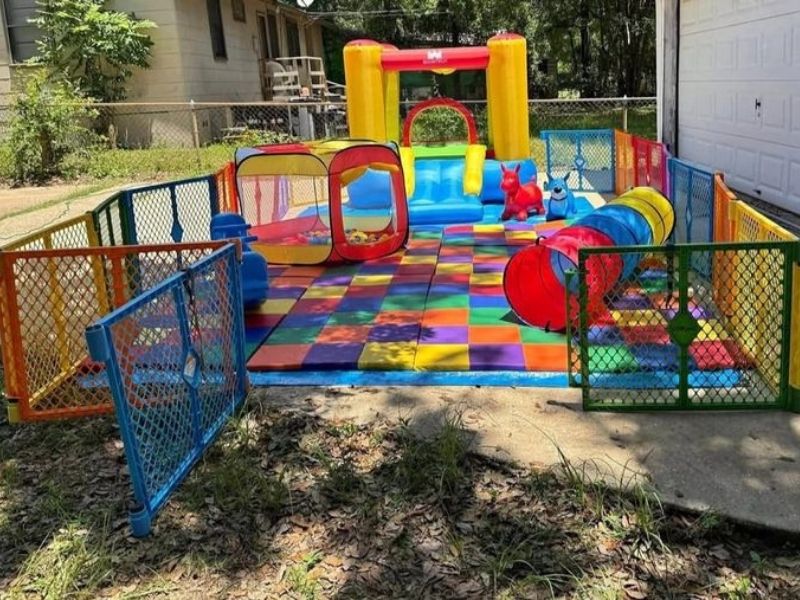Large-playpen-housing-toys-of-different-types-and-colors.