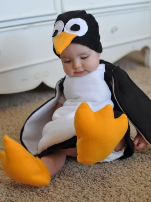 Baby-dressed-in-penguin-costume-in-baby's-first-halloween-costume-ideas.