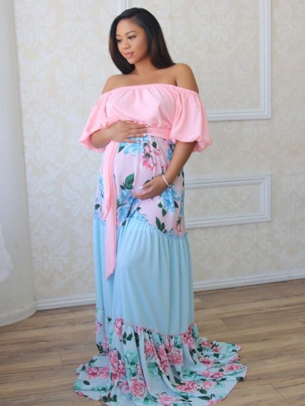 Woman-wearing-pink-and-blue-floral-maternity-dress.