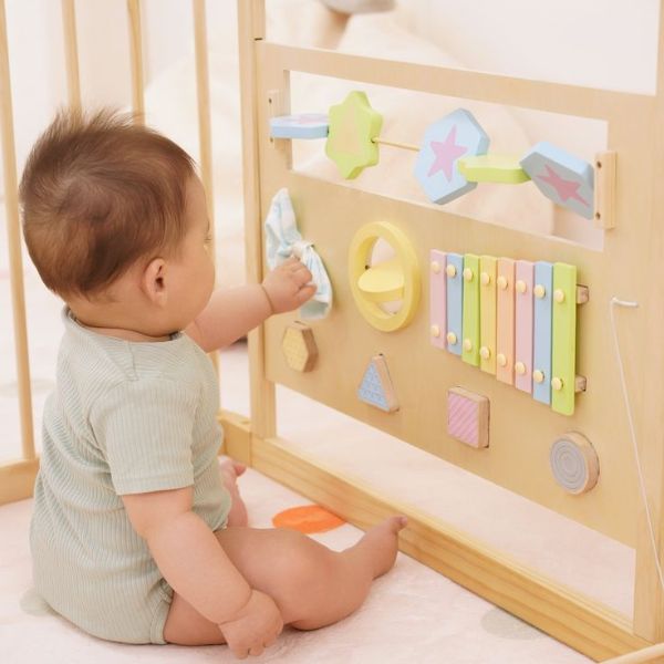 Baby-playing-in-playpen-with-activity-panels-in-baby-playpen-ideas-for-babies-and-toddlers.