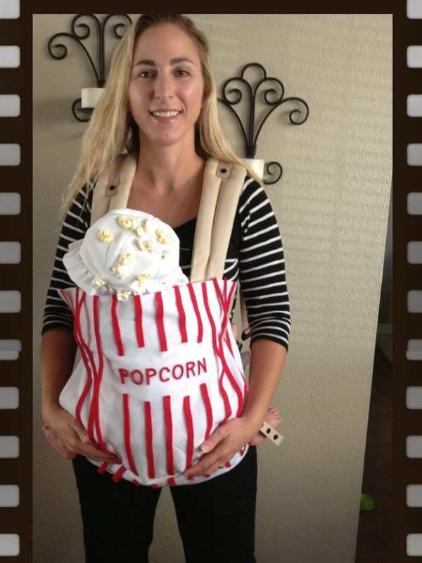 Mom-carrying-baby-in-popcorn-bag-babywearing-costume-in-baby-carrier-costume-ideas-for-babywearing-this-halloween.