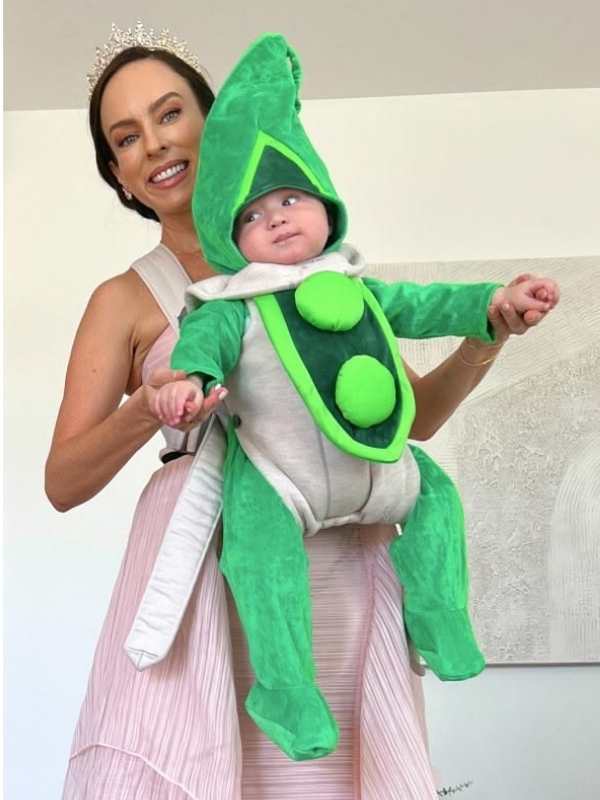 Mom-carrying-her-baby-in-princess-and-pea-costume-in-baby-carrier-costume-ideas-for-babywearing-this-halloween.