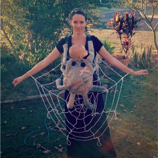 Mom-carrying-baby-in-spider-web-costume.
