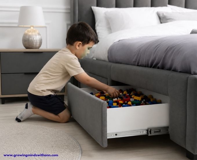 A-child-trying-to-bring-out-LEGO-toy-from-under-the-bed-LEGO-storage-in-LEGO-storage-and-organization-ideas
