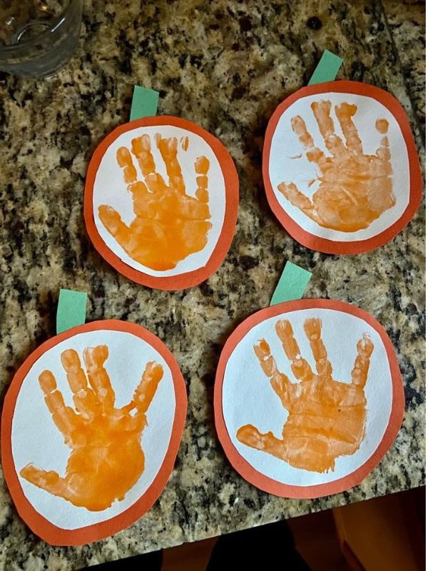 Four-handprint-pumpkin-in-fall-handprint-craft-ideas-for-kids.