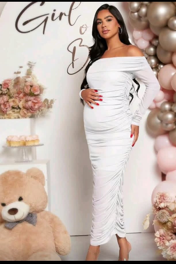 Woman-wearing-a-white-off-shoulder-dress-ingender-reveal-ideas-for-mom-to-be.
