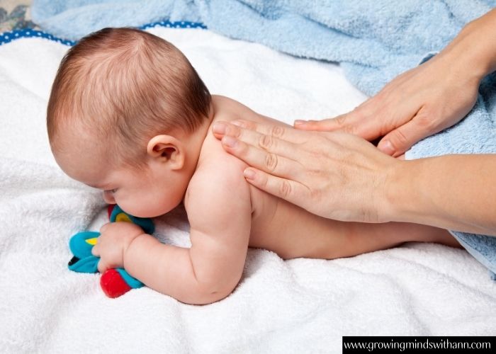 Mom-massaging-her-baby's-back.