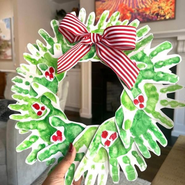 Handprint-wreath-designed-in-red-and-green-colors-in-Christmas-keepsakes-kids-can-make-for-their-parents.