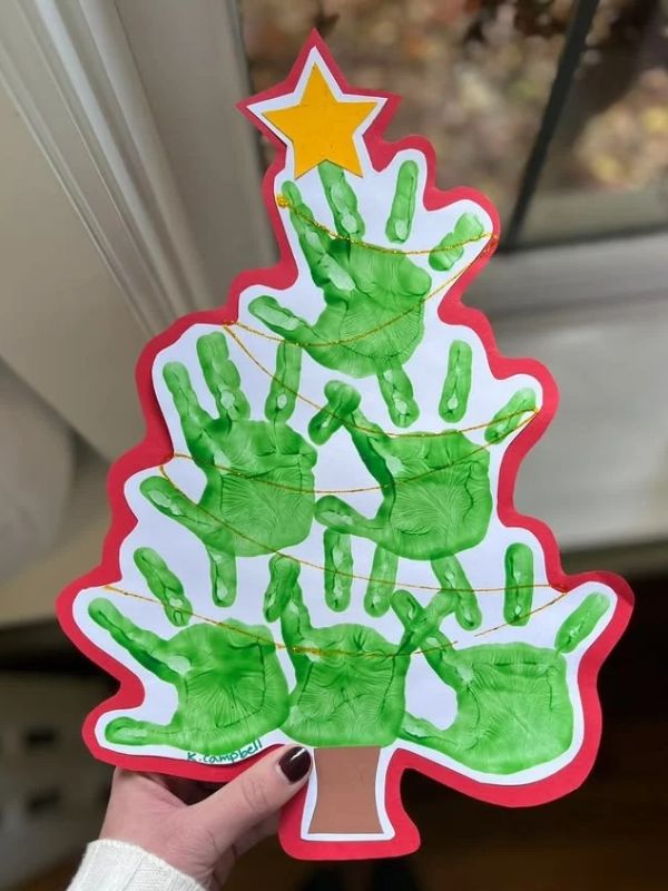 Handing-holding-handprint-chrisstmas-tree.