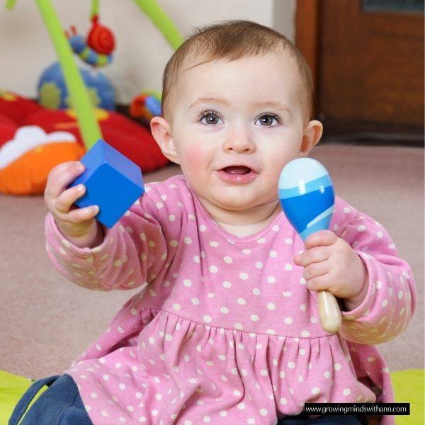 Baby-playing-with-baby-shakers.
