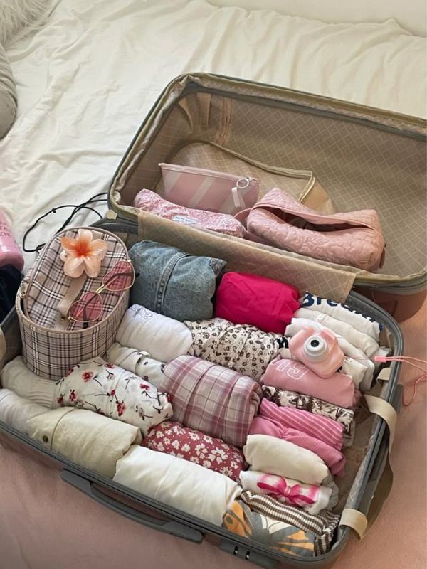 Kit-containing-sweater-socks-blanket-and-other-essentials-in-travelling-essential-kits-for-kids.