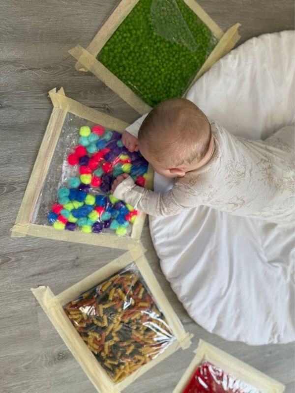 Baby-playing-with-sensory-bag.