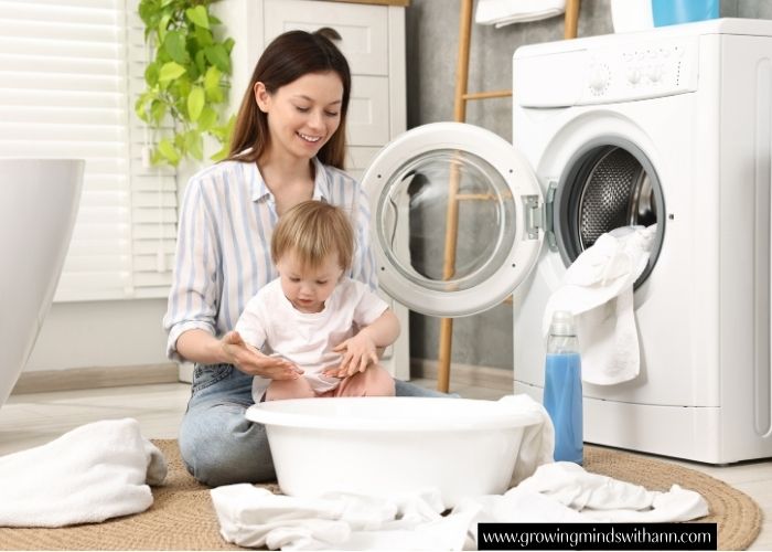 Mom-with-baby-beside-washing-machine.