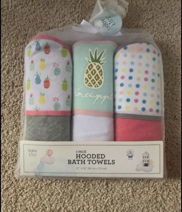 Three-hooded-baby-bath-towels-packaged-together-in-a-nylon-in-bathtub-baby-shower-gift-ideas-for-new-moms.