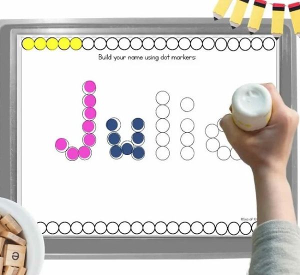Hand-doing-dot-marker-activity-with-the-name-Julie-in-name-activities-for-preschoolers.