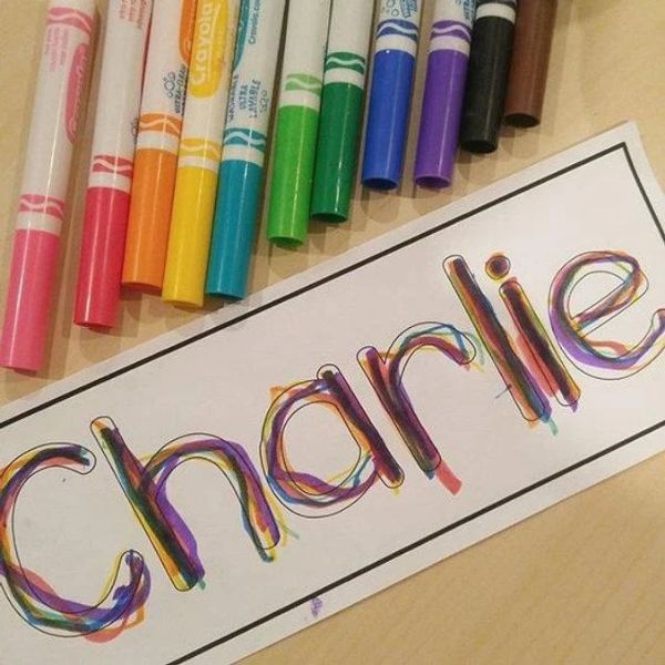 Charlie-rainbow-writing-with-different-colors-of-makers-beside-it-in-name-activities-for-preschoolers.
